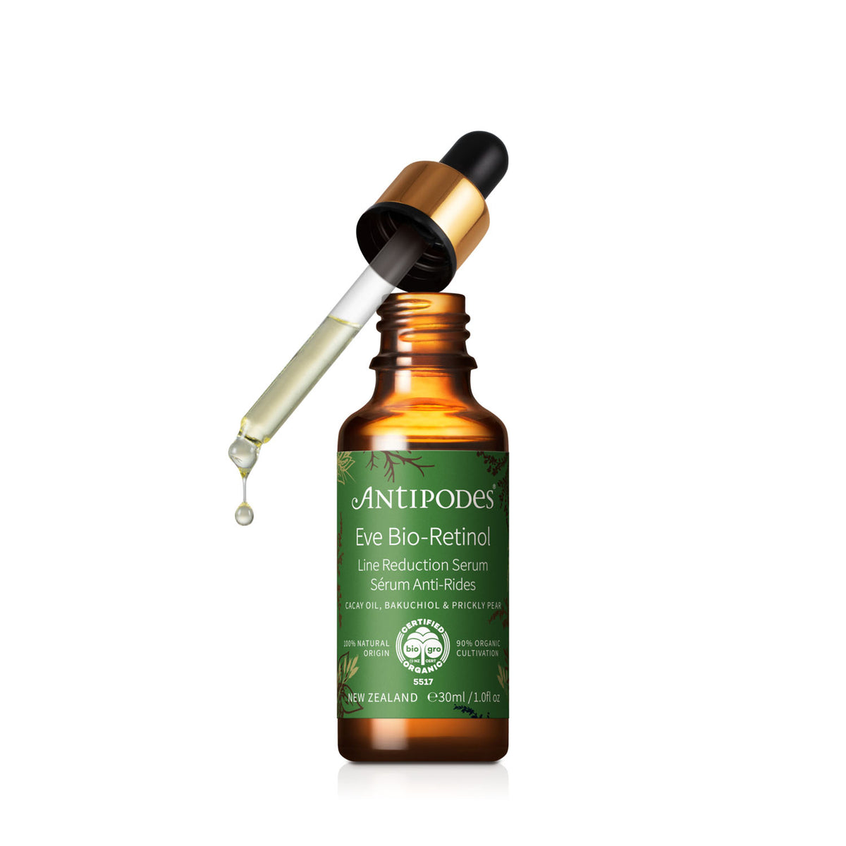 An amber glass bottle of Antipodes Eve Bio-Retinol serum with a green label, shown with a gold-and-black dropper resting above the open bottle on a white background.